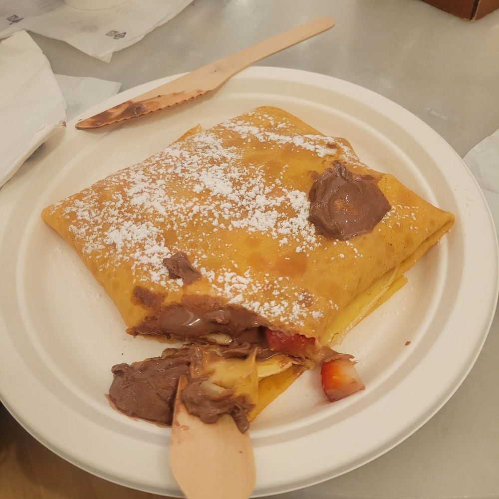 Gelateria Cremilla - Strawberry crepe i had taken a bite and added some of my son's milk chocolate gelato on top - Desserts Near Me - Rome, RM