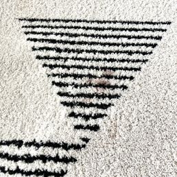Close up of one of the blood stains that rose to the surface after the first cleaning. They were able to get it out!