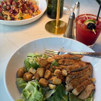 Dapper Dine & Lounge - There's poki nachos and a Caesar salad. As well as a raspberry margarita and a cucumber mint drink. - Cocktail Bars Near Me - Riverside, California