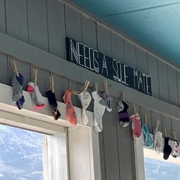 Socks missing a mate. Funny sign saying it needs a sole mate. Socks missing a mate. Funny sign saying it needs a sole mate.