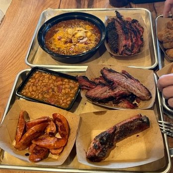 Fountain BBQ - a variety of food items on trays - Barbeque Near Me - Idaho Springs, Colorado Fountain BBQ - a variety of food items on trays - Barbeque Near Me - Idaho Springs, Colorado