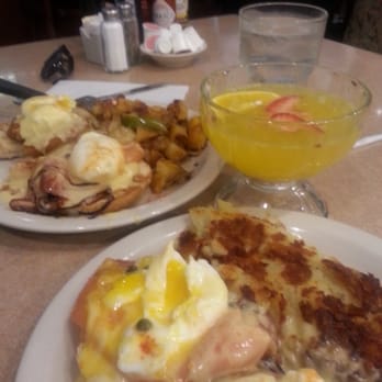 Bill's Cafe - Smoked salmon and crab cake eggs benedict with hash browns and potatoes. With a mimosa - American Near Me - San Jose, California