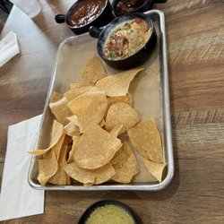 Fresh chips and queso with chorizo, salsa picante, red salsa, and a creamy green salsa (which we ordered more of!!)