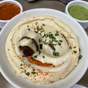 Pomella - Hummus Plate with Cheese-Stuffed Falafel, Harissa, and Zhoug - Middle Eastern Near Me - Oakland, California Pomella - Hummus Plate with Cheese-Stuffed Falafel, Harissa, and Zhoug - Middle Eastern Near Me - Oakland, California