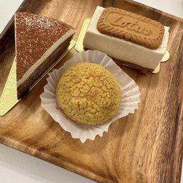 Tiramisu crepe, biscoff cheesecake and a cream puff Tiramisu crepe, biscoff cheesecake and a cream puff