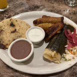 Lunch #6, pupusa, tamale, plantains, beans and slaw with sour cream. Lunch #6, pupusa, tamale, plantains, beans and slaw with sour cream.