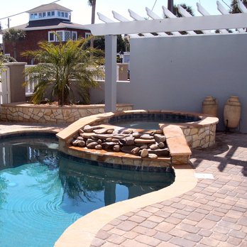 Randy & Ray's - Pool deck, spa, and raised landscape bed with pavers, flagstone and natural stones complete with pergola - all by Randy & Ray's LLC - Patio Coverings Near Me Randy & Ray's - Pool deck, spa, and raised landscape bed with pavers, flagstone and natural stones complete with pergola - all by Randy & Ray's LLC - Patio Coverings Near Me
