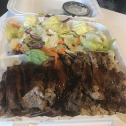 Close up of chicken teriyaki with brown rice and salad Close up of chicken teriyaki with brown rice and salad
