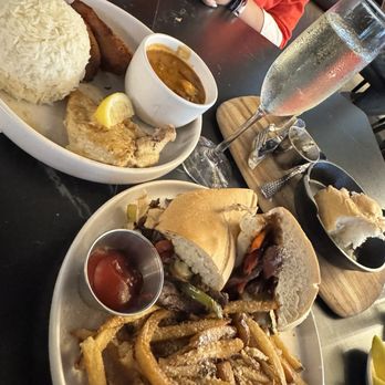 Tallo - lemon chicken breast and steak sandwich with parmesan fries - Caribbean Near Me - Wesley Chapel, Florida