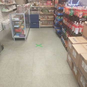 Bellwood Sweets - a grocery store aisle with a green x on the floor - Grocery Near Me - Bellwood, Illinois Bellwood Sweets - a grocery store aisle with a green x on the floor - Grocery Near Me - Bellwood, Illinois