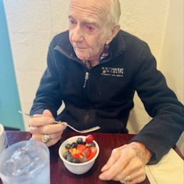 Dad and his fruit cup at his fave breakfast spot. Dad and his fruit cup at his fave breakfast spot.