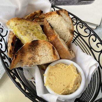 Kyma - Bread and pita with hummus - Seafood Near Me - Roslyn, New York