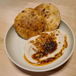 Butter bean hummus with warm pita & Aleppo chili crunch