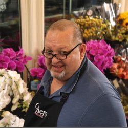 Carithers Flowers - Michael inspecting today's fresh flowers