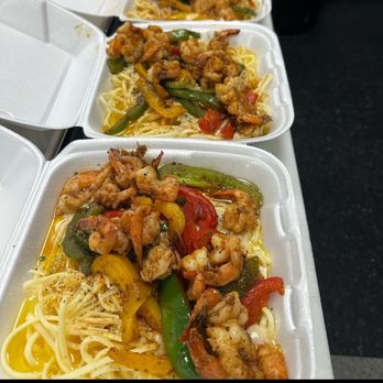 Pasta Bowl Restaurant - a row of takeout containers - Soul Food Near Me - Detroit, Michigan Pasta Bowl Restaurant - a row of takeout containers - Soul Food Near Me - Detroit, Michigan