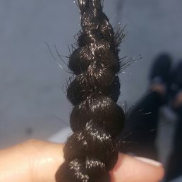 Carefully sculpted end of braid Carefully sculpted end of braid