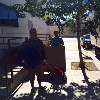 Clutter Storage - Elvis and Taylor in action! - Self Storage Near Me