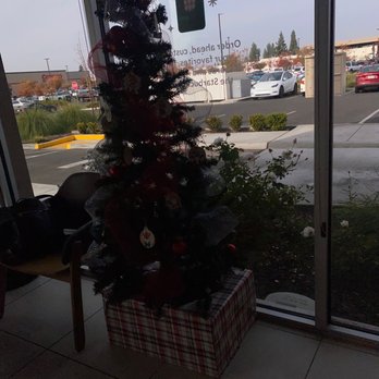 Starbucks - a christmas tree in front of a window - Coffee & Tea Near Me - Clovis, California Starbucks - a christmas tree in front of a window - Coffee & Tea Near Me - Clovis, California