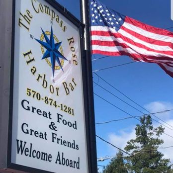 Compass Rose Harbor Bar - a sign with an american flag - Bars Near Me - Frackville, Pennsylvania