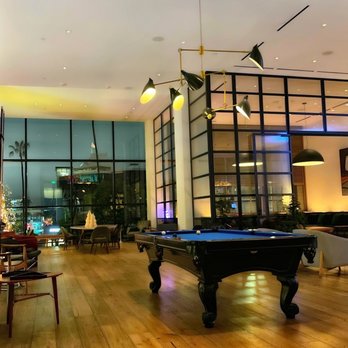 Written Hand - a pool table in the middle of the room - Bars Near Me - Los Angeles, California Written Hand - a pool table in the middle of the room - Bars Near Me - Los Angeles, California