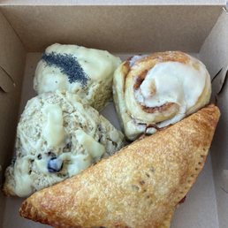 Lemon poppyseed scone (back left), cinnamon bun (back right), cherry turnover (front), and lemon blueberry scone (mid left) Lemon poppyseed scone (back left), cinnamon bun (back right), cherry turnover (front), and lemon blueberry scone (mid left)