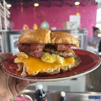 Gimme Some Sweets - Breakfast sandwich: bacon, scrambled egg , sausage croissant - Bakeries Near Me - Sealy, Texas Gimme Some Sweets - Breakfast sandwich: bacon, scrambled egg , sausage croissant - Bakeries Near Me - Sealy, Texas