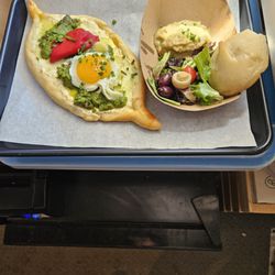 Double Up - On left - Khachapuri Georgian cheese pie. On right - Babaganoush.