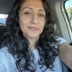 Curly medium layer cut.