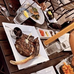 Sinners Steakhouse - Tomahawk steak and salmon