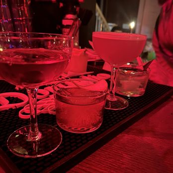 Amazonia - a glass of wine on a tray - Cocktail Bars Near Me - Lakewood, Ohio