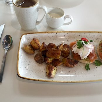 Everly - SO YUMMY smoked salmon eggs benedict pictured here (also would recommend chilaquiles) - New American Near Me - Madison, Wisconsin Everly - SO YUMMY smoked salmon eggs benedict pictured here (also would recommend chilaquiles) - New American Near Me - Madison, Wisconsin