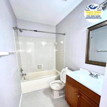 Triple State Construction - a bathroom with a sink, toilet, and bathtub - General Contractors Near Me Triple State Construction - a bathroom with a sink, toilet, and bathtub - General Contractors Near Me