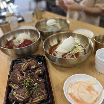 Hampyong Cold Noodles - a variety of dishes on a table - Korean Near Me - Carrollton, Texas Hampyong Cold Noodles - a variety of dishes on a table - Korean Near Me - Carrollton, Texas