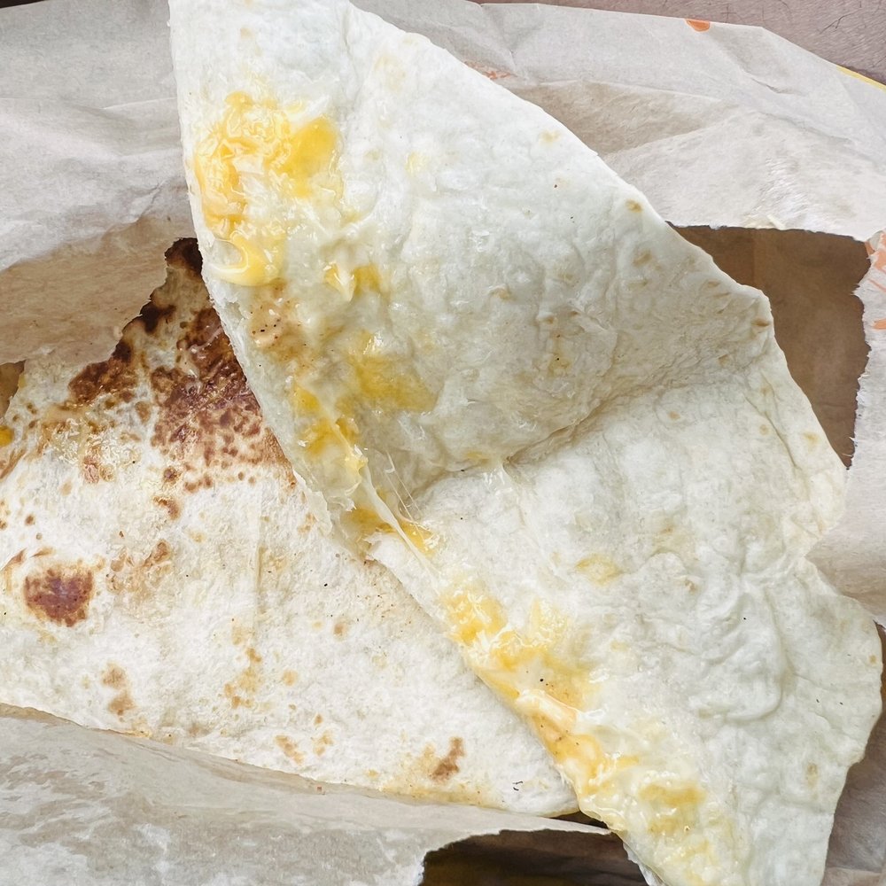 Taco Bell - Chicken Quesadilla with half filing - Fast Food Near Me - Kyle, Texas Taco Bell - Chicken Quesadilla with half filing - Fast Food Near Me - Kyle, Texas