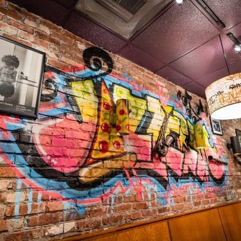 Wilton Pizza - a brick wall with graffiti on it - Pizza Near Me - Wilton, Connecticut Wilton Pizza - a brick wall with graffiti on it - Pizza Near Me - Wilton, Connecticut