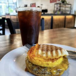 Logan House Coffee - Sausage Egg & Cheese Muffin and Iced Americano