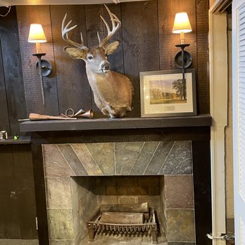 Higher Ground Property Management - a deer head mounted on a fireplace - General Contractors Near Me Higher Ground Property Management - a deer head mounted on a fireplace - General Contractors Near Me