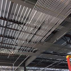 Reliant Electric - Home-run conduit rack. Five panels and lighting-contactor panel woven together.