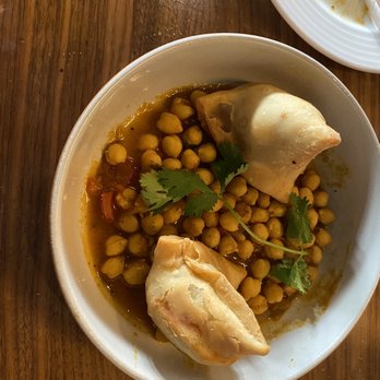 Dancing Yak - Freshly made samosa on bed of chickpeas as the chutney - Himalayan/Nepalese Near Me - San Francisco, California