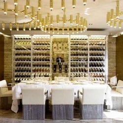 Gold - The Restaurant / Restrooms behind the table [Photo from website]