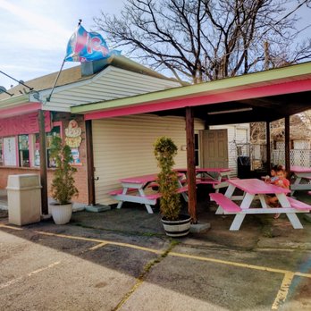 Cool Corner Creamery - a woman sitting at a pink picnic table - Ice Cream & Frozen Yogurt Near Me - Woonsocket, Rhode Island