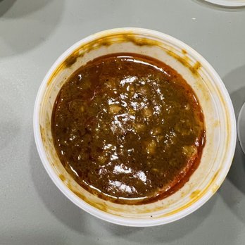 Khan Kabob House - a bowl of soup and a spoon on a table - Pakistani Near Me - Chantilly, Virginia