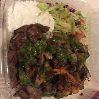 Kwik Meal - Lamb over rice with a shrimp and salad. White yogurt sauce, and hot sauce. - Street Vendors Near Me - New York, New York