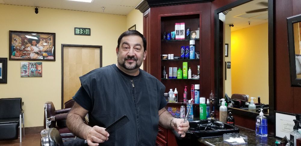 Aron's Barber Shop Logo