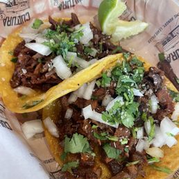 Carne asada tacos with cilantro and onions