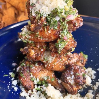 Doc B's Restaurant + Bar - Oven Roasted Chicken Wings: chimichurri, reggiano, lemon - Bars Near Me - Tampa, Florida