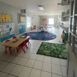 Bright and colorful preschool classroom at Childcare Network with age-appropriate learning materials