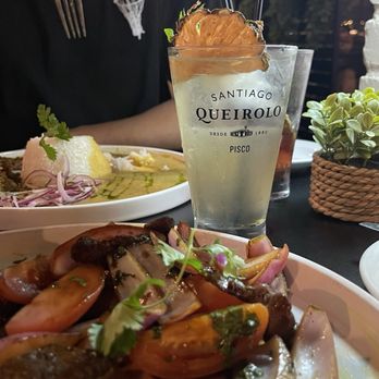 Paititi Peruvian Bistro - Lomo Saltado (GF OPTION) Pisco sour - Peruvian Near Me - Sacramento, California Paititi Peruvian Bistro - Lomo Saltado (GF OPTION) Pisco sour - Peruvian Near Me - Sacramento, California