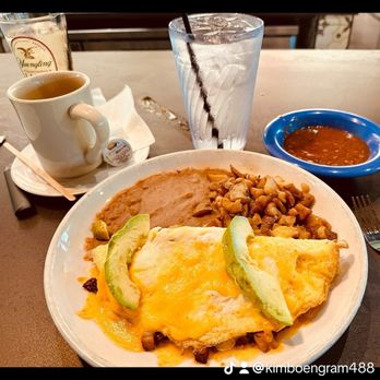 Rio Grande Tex-Mex Restaurant - Breakfast omelette with three fried beans, potatoes, flour tortillas, hot sauce, hot brew, coffee, and ice water - Tex-Mex Near Me - Hutto, Texas Rio Grande Tex-Mex Restaurant - Breakfast omelette with three fried beans, potatoes, flour tortillas, hot sauce, hot brew, coffee, and ice water - Tex-Mex Near Me - Hutto, Texas
