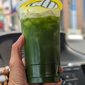 Wonderful Matcha - a person holding a cup of matcha - Tea Rooms Near Me - La Grange, Illinois Wonderful Matcha - a person holding a cup of matcha - Tea Rooms Near Me - La Grange, Illinois
